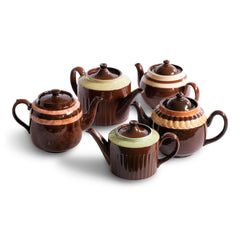A collection of Brown Betty Teapots in various colour ways. 