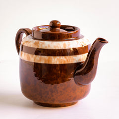 A good 6 cup original Brown Betty teapot with toffee marbled banding and splatter glaze.