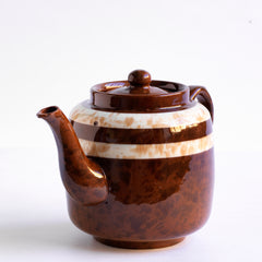 A good 6 cup original Brown Betty teapot with toffee marbled banding and splatter glaze.