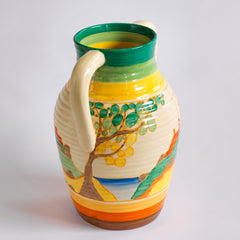 An original 1930s Clarice Cliff twin handle lotus jug in the Secrets pattern. The underside is stamped "Fantasque Hand Painted Bizarre by Clarice Cliff Newport Pottery England", and it's a good early one, dating to 1933; and better still, it is beautifully hand painted and in immaculate condition.