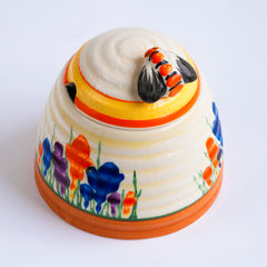 A wonderful Clarice Cliff Autumn Crocus beehive honey pot with good, bright and bold paintwork. The underside is stamped "Crocus Hand painted Bizarre by Clarice Cliff Newport Pottery England",and it's a good early one, dating to 1930 / 1931 and in beautiful condition.