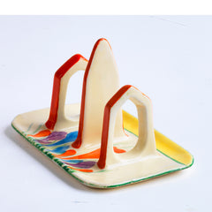 Original 1920s Clarice Cliff Autumn Crocus toast rack for two with good, bright and bold paintwork. The underside is stamped "Hand painted Bizarre by Clarice Cliff Wilkinson Ltd England".