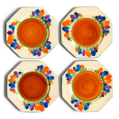 Clarice Cliff early Autumn Crocus octagonal tea plates with vivid paintwork and boldly executed crocuses, and with early hand painted green "Crocus" stamp on the reverse. The underside to each is also stamped "Hand painted Bizarre by Clarice Cliff, Newport Pottery England". 