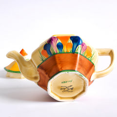 The underside of a good early original Clarice Cliff Autumn Crocus Athens teapot with vivid paintwork and boldly executed crocuses. The underside is stamped "Hand painted Bizarre by Clarice Cliff, Newport Pottery England", and dates it to 1928/29.