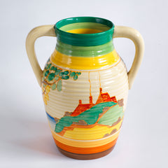An original 1930s Clarice Cliff twin handle lotus jug in the Secrets pattern. The underside is stamped "Fantasque Hand Painted Bizarre by Clarice Cliff Newport Pottery England", and it's a good early one, dating to 1933; and better still, it is beautifully hand painted and in immaculate condition.