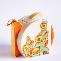 A 1930s original Clarice Cliff Stamford teapot in Sunshine pattern, painted with yellow hollyhocks, and with Bizarre and Sunshine stamped to its underside, and in immaculate condition.