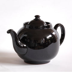 A classic 1930s 6 cup original Brown Betty teapot with a dark bitter chocolate glaze.