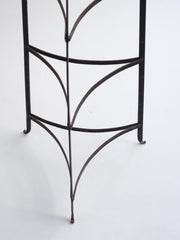 A large antique cast steel saucepan stand that will hold up to 6 saucepans.