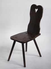 A Romanian alpine folk art style stick-leg chair with high back and charming heart detail, most likely from the Carpathian Mountains.