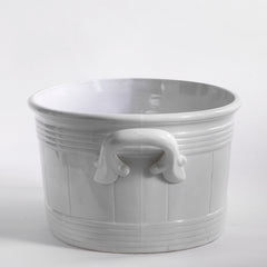 A late 19th century French oval-shaped foot bath with roll-top rim, raised banding, and very elegant handles.