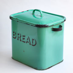 A 1930s rectangular green enamel bread bin with "BREAD" in 3-D black enamel, rounded corners and original lid.