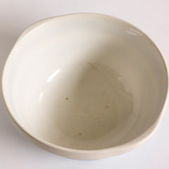 The inside of a T G Green Cornish Kitchenware small mixing bowl dating to 1930 - 1950. It bears the green shield stamp to its base and is marked "T G Green & Co Ltd / Cornish Kitchen Ware / Made in England".