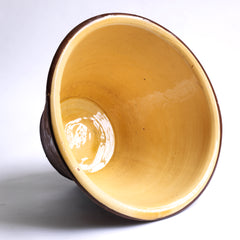 A late nineteenth century bread proving bowl with a honey coloured glazed interior, burnt biscuit exterior, and a deep rolled rim. 