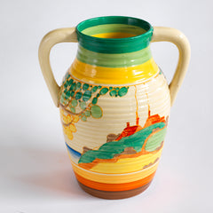 An original 1930s Clarice Cliff twin handle lotus jug in the Secrets pattern. The underside is stamped "Fantasque Hand Painted Bizarre by Clarice Cliff Newport Pottery England", and it's a good early one, dating to 1933; and better still, it is beautifully hand painted and in immaculate condition.