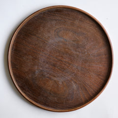 Part of a mid century vintage Poole Pottery seafood hors d'oeuvre set that consists of five ceramic dishes that fit snugly into a circular wooden tray (as shown here). Each crescent shaped dish is decorated with a hand painted pattern of a shrimp, a flatfish, a crab and a scallop - designed by Truda Carter and hand painted on Poole Pottery's alpine white glaze. Each piece is stamped to its underside "Handmade Hand Decorated Poole England", along with the paintress's mark.