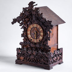 This stunning cuckoo clock, encrusted in a sleeping-beauty thicket of finely carved foliage is one of the first of its kind, and is by Johann Baptist Beha, the most prestigious of nineteenth century Black Forest clock makers. It’s early, a rarity, and few exist - and is known as model 509.