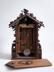 This stunning cuckoo clock, encrusted in a sleeping-beauty thicket of finely carved foliage is one of the first of its kind, and is by Johann Baptist Beha, the most prestigious of nineteenth century Black Forest clock makers. It’s early, a rarity, and few exist - and is known as model 509.