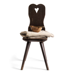 A Romanian alpine folk art style stick-leg chair with high back and charming heart detail, most likely from the Carpathian Mountains.