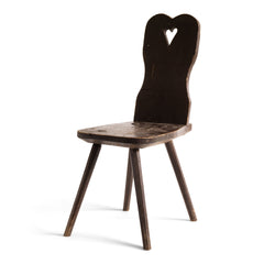 A Romanian alpine folk art style stick-leg chair with high back and charming heart detail, most likely from the Carpathian Mountains.
