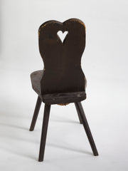 A Romanian alpine folk art style stick-leg chair with high back and charming heart detail, most likely from the Carpathian Mountains.