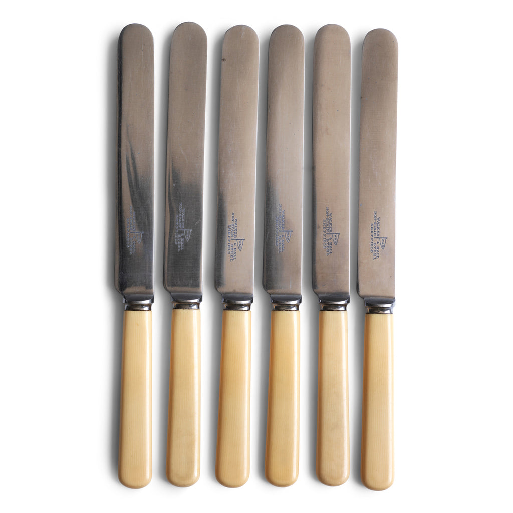 A good set of 6 large 'bone' handled Walker & Hall dinner knives, each blade marked "Walker & Hall non-stain steel Sheffield".