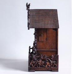 This stunning cuckoo clock, encrusted in a sleeping-beauty thicket of finely carved foliage is one of the first of its kind, and is by Johann Baptist Beha, the most prestigious of nineteenth century Black Forest clock makers. It’s early, a rarity, and few exist - and is known as model 509.