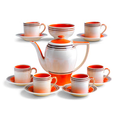 A stunning 1930s Art Deco Susie Cooper coffee set in her classic Rex shape with tango orange banding. The Susie Cooper trademark signature is on the underside of each piece, and the set includes a coffee pot, sugar bowl, and six cans & saucers - and all in wonderful condition.