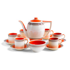 A stunning 1930s Art Deco Susie Cooper coffee set in her classic Rex shape with tango orange banding. The Susie Cooper trademark signature is on the underside of each piece, and the set includes a coffee pot, sugar bowl, and six cans & saucers - and all in wonderful condition.