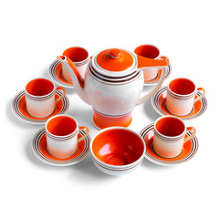 A stunning 1930s Art Deco Susie Cooper coffee set in her classic Rex shape with tango orange banding. The Susie Cooper trademark signature is on the underside of each piece, and the set includes a coffee pot, sugar bowl, and six cans & saucers - and all in wonderful condition.