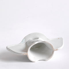 Underside of an antique Grimwades ironstone "Bleriot" combined pie funnel and pie divider.