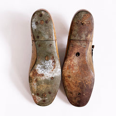 A good pair of antique late nineteenth century polished wooden shoe lasts with leather uppers and steel soles, as shown here.