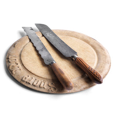 A collection of two handsome antique bread knives and a rare Victorian treen "Spare Not" bread board.