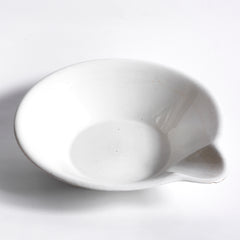 A super-large Victorian ironstone dairy pouring bowl by the "Dairy Supply Company London" (stamp applied to underside) with a rolled rim and a particularly striking pouring lip.