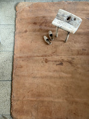 A large soft leather mat with lovely time-worn patina, converted from a 1930s gym mat.