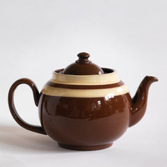 A good 4 cup Brown Betty teapot with a double custard stripe and plain brown glaze.&nbsp;