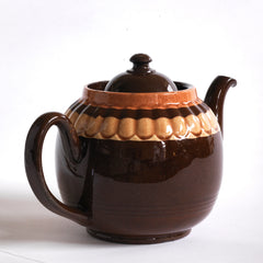 A good large 6 cup original Brown Betty teapot with mustard banding and raised pie-crust style fluting.