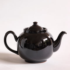 A classic 1930s 6 cup original Brown Betty teapot with a dark bitter chocolate glaze.