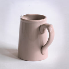 1920s stoneware cream jug with  a delicious dead salmon glaze and "Dudson Hanley England Vitrified Stoneware" stamped on its base.