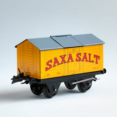 A rare 1940s Hornby Trains 0-gauge series Saxa Salt wagon "Salt Wagon Saxa No.50", and in mint condition. It has an opening roof hatch, and comes with its original mint green box.&nbsp;