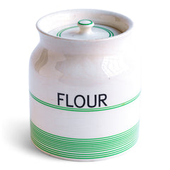 A large 1930s ceramic Kleen Kitchen Ware 4 pint food canister with its original lid by Sadler. The base is stamped "Kleen Kitchen Ware Sadler 4 PINT", and it is banded with green stripes to its body and lid, along with good strong "FLOUR" black typography to its front.