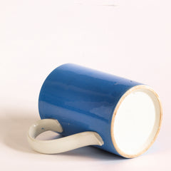 A Mochaware one pint  pub mug in sky blue glaze made by Pountney &  Co. Ltd. of Bristol, with a  watermark  stamped on the side for King George V - a crown flanked by the letters G and R, George Rex.