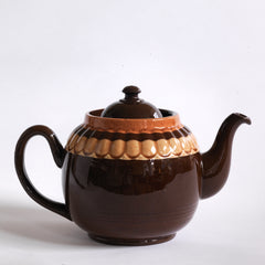 A good large 6 cup original Brown Betty teapot with mustard banding and raised pie-crust style fluting.