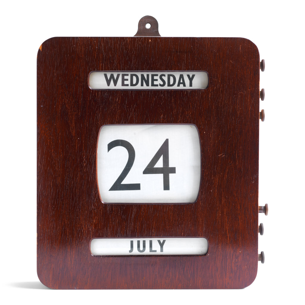A good-looking 1940s wall-mounted post office perpetual calendar. The day, date and month are are printed on linen which wind on three internally mounted rollers, each set behind its own glazed window. The rollers are operated by the knobs located on the side. It is in excellent working order and the wooden case has its original stained finish and glazing. The linen is in very good clean condition and the rollers turn well. The case is constructed from a combination of wood and ply, and is fitted with a wal
