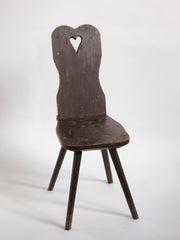 A Romanian alpine folk art style stick-leg chair with high back and charming heart detail, most likely from the Carpathian Mountains.