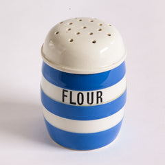 A vintage T G Green Cornish Kitchenware flour shaker or dredger dating to 1930 - 1950. It bears the green shield stamp to its base and is marked "T G Green and Co Ltd Cornish Kitchen Ware Made in England".