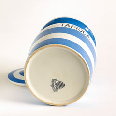The underside of a vintage  T G Green Cornish Kitchenware Tapioca storage jar with lid dating to 1930 - 1950. The "Tapioca" typography is strong, and the jar is of a particularly large size. It bears the black shield stamp to its base and is marked "T G Green & Co Ltd / Cornish Kitchen Ware / Made in England".