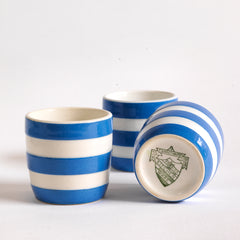 T G Green Cornish Kitchenware egg cups dating to 1930 - 1950. They bear the green shield stamp to their bases and are marked "T G Green and Co Ltd Cornish Kitchen Ware Made in England".