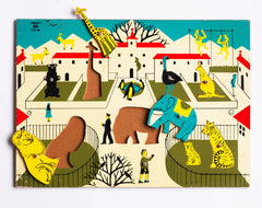 An absolutely charming early 1960s zoo puzzle made of painted wood, with cut-out animals, zoo keepers and visitors; some of which have a wee knob to lift them out by. 