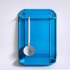 A vintage blue enamel kitchen utensil wall-mounted rack and drainer, ideal for the hanging of ladles, scoops and spoons, and manufactured by Kockums of Sweden.