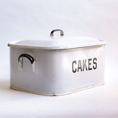 A rare 1930s rectangular half-size white enamel cake tin with rounded corners, original lid and good "CAKES" typeface in black.